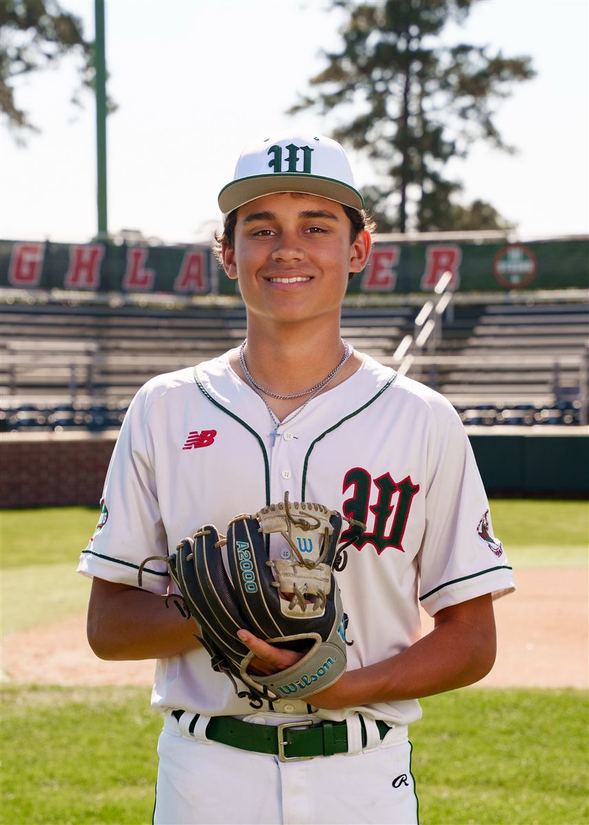 Jason's son in his baseball uniform on the field